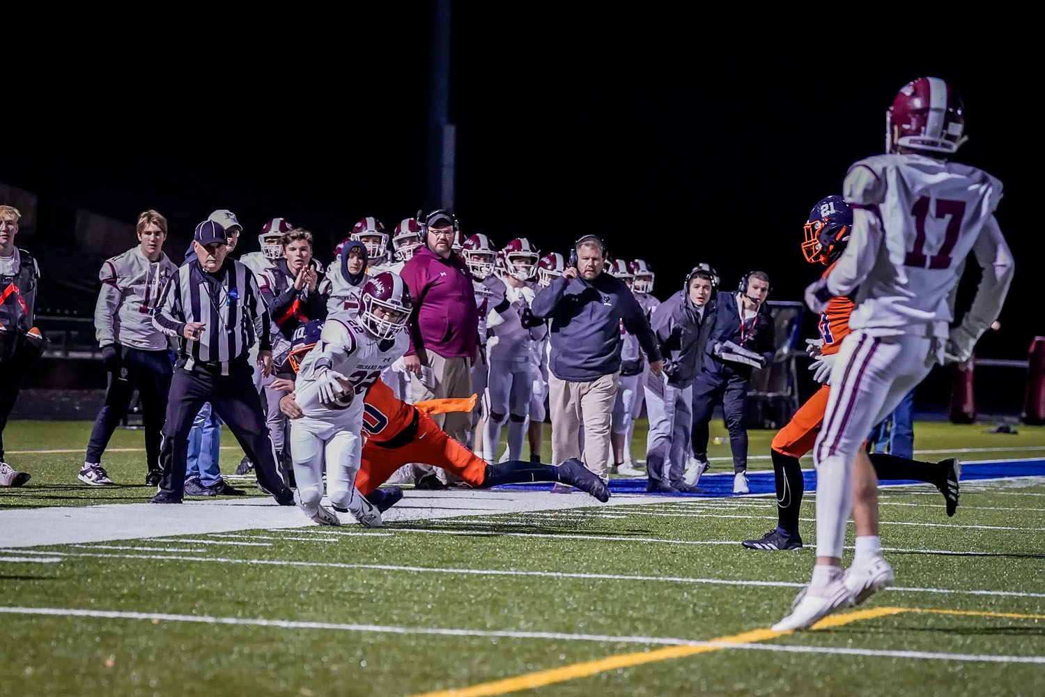 OP ball carrier reaching out for more yards