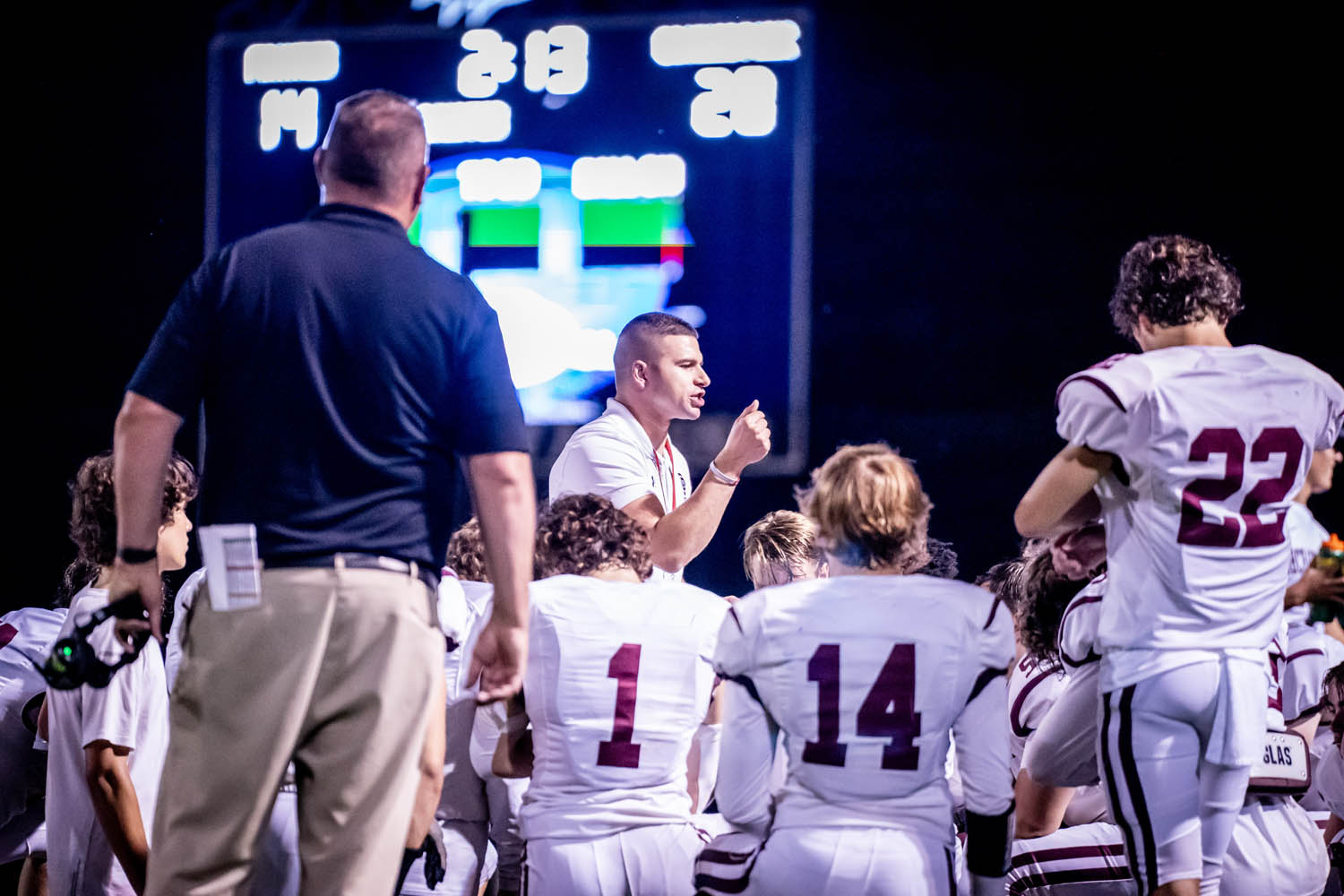 Coach talking to the team at the half