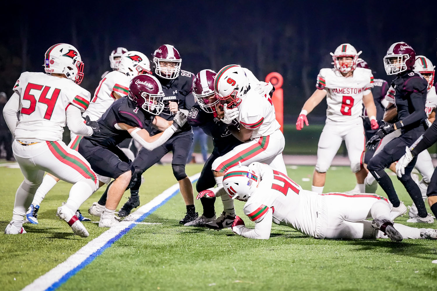 Orchard Park Defenders stopping the ball carrier