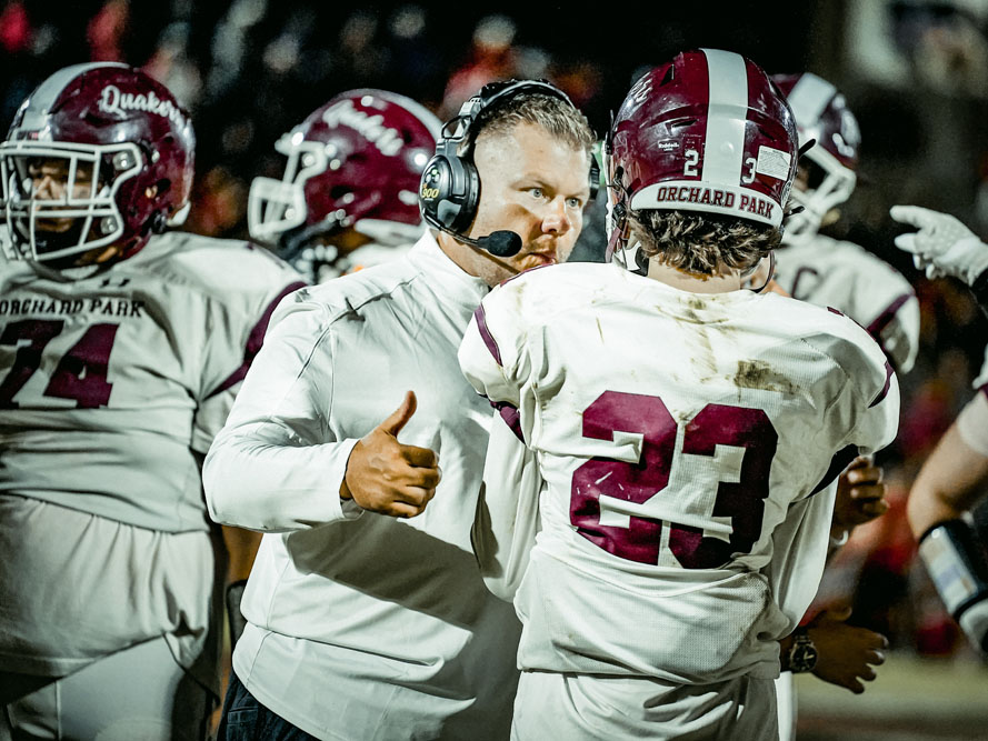 Coach talking to his player