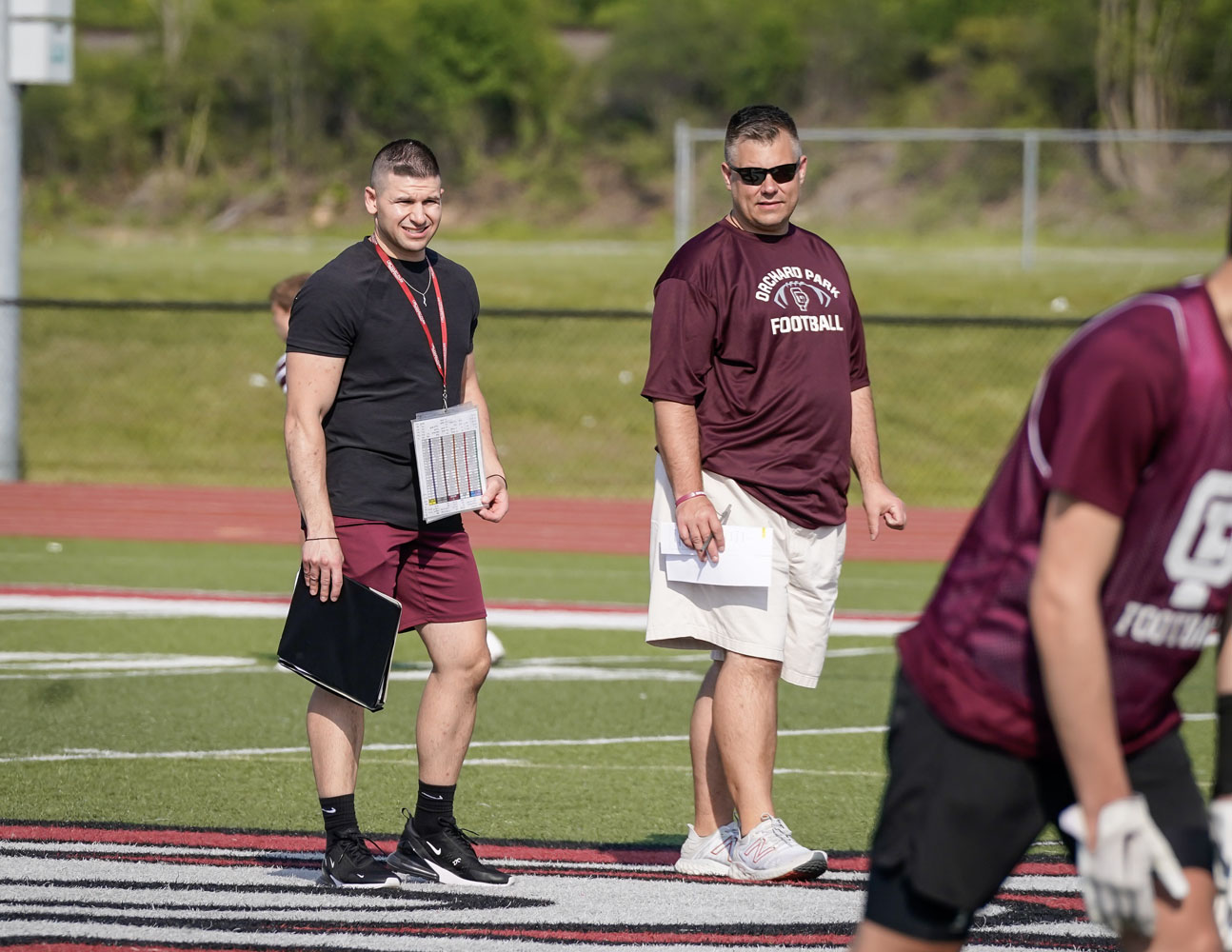 Orchard Park Coaches watching over the team