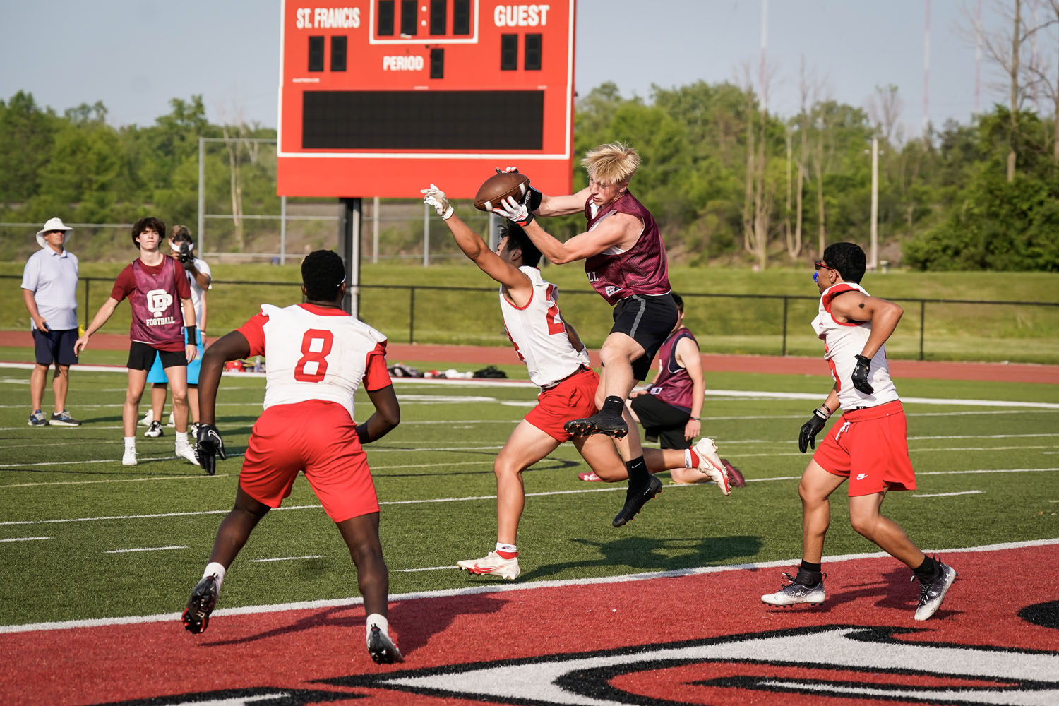 Receiver bringing in the ball in the endzone