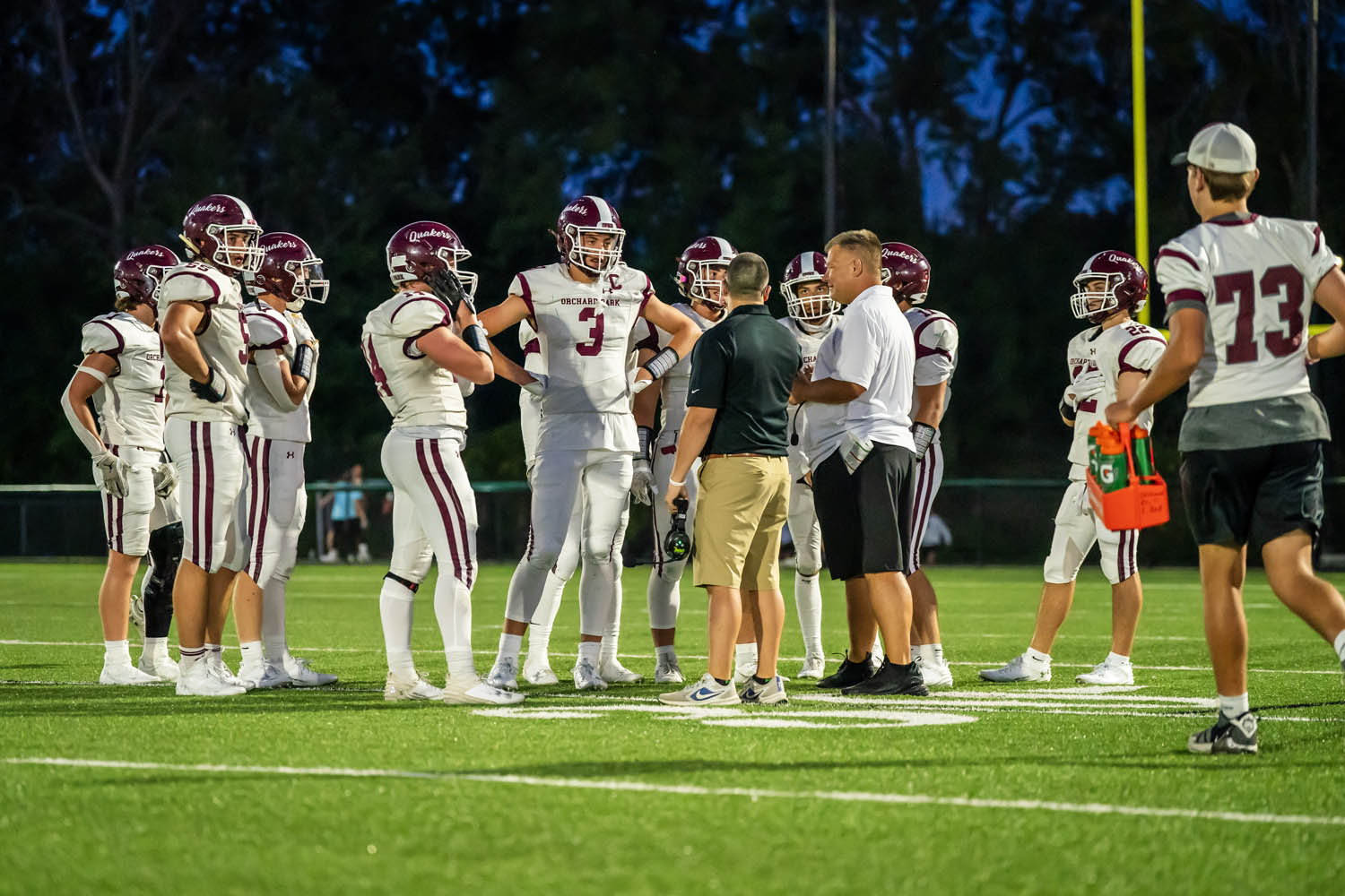 The coaches giving out instructions