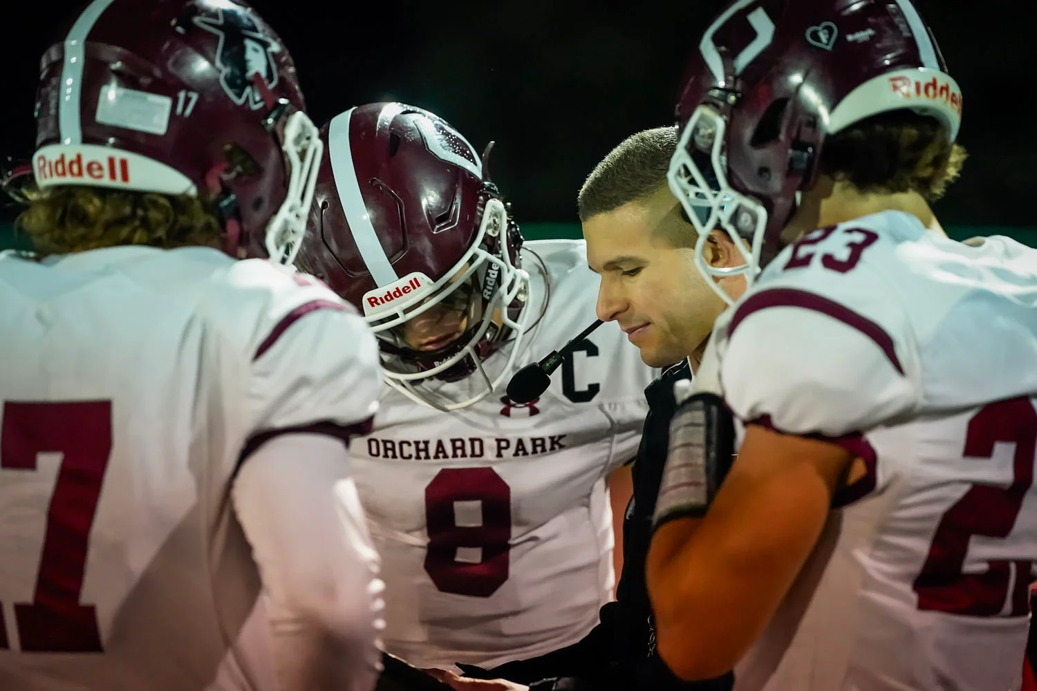 Coach talking to the team in the huddle