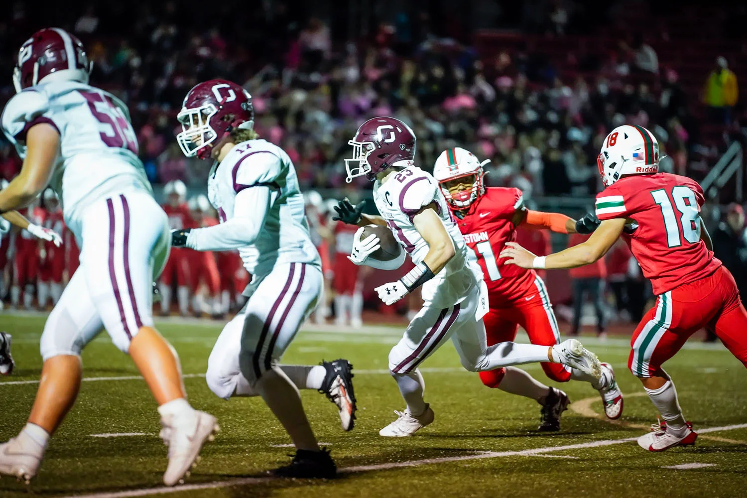 Ball Carrier following his lead blockers