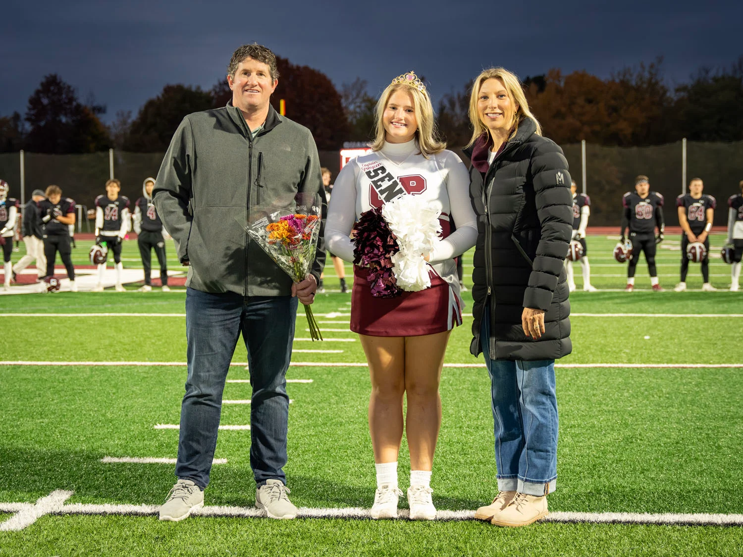 Cheerleader and Family on Senior Night