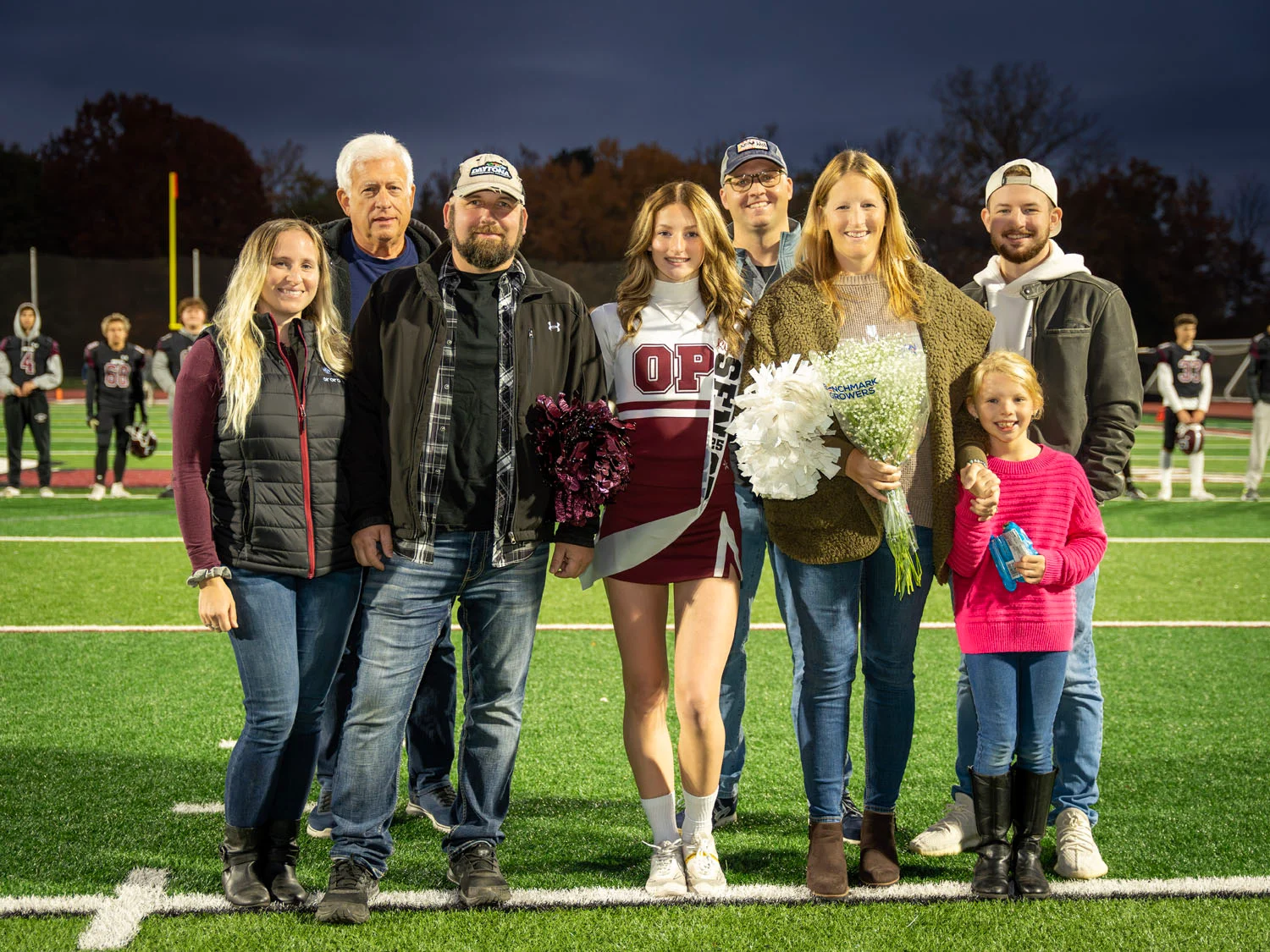 Cheerleader and Family on Senior Night