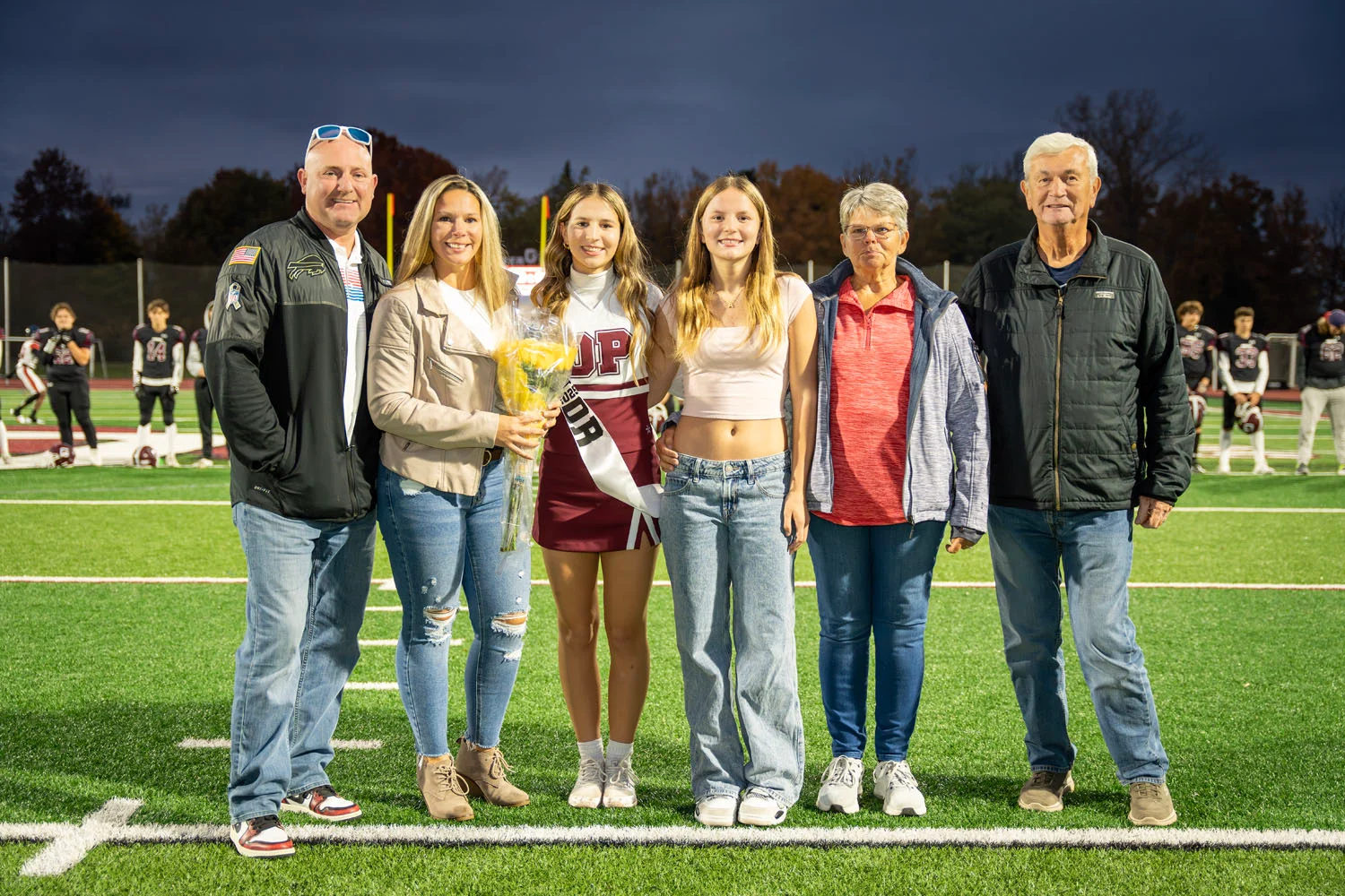 Cheerleader and Family on Senior Night