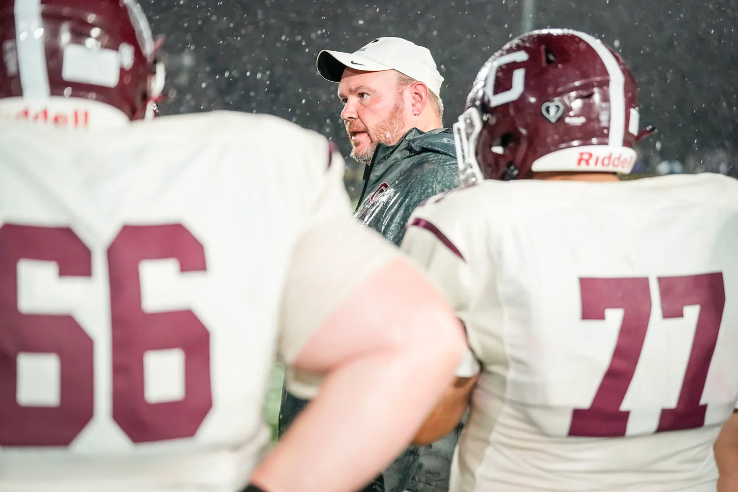 Coach on the sidelines coaching the team