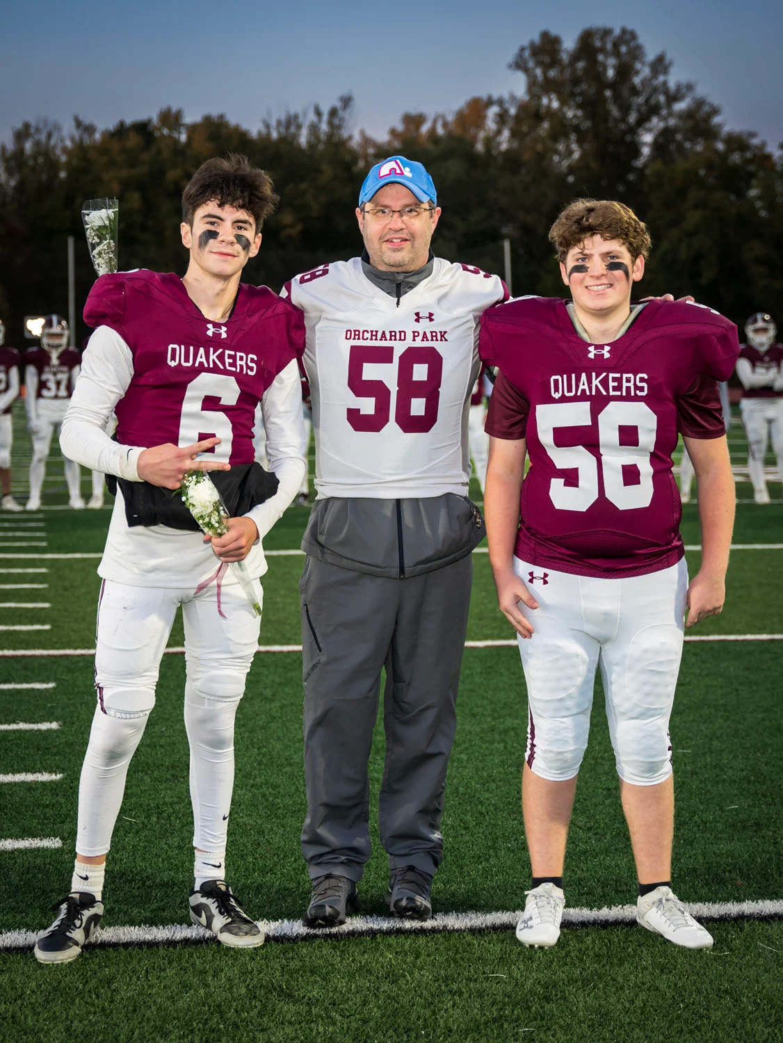 Teacher and player on Senior Night