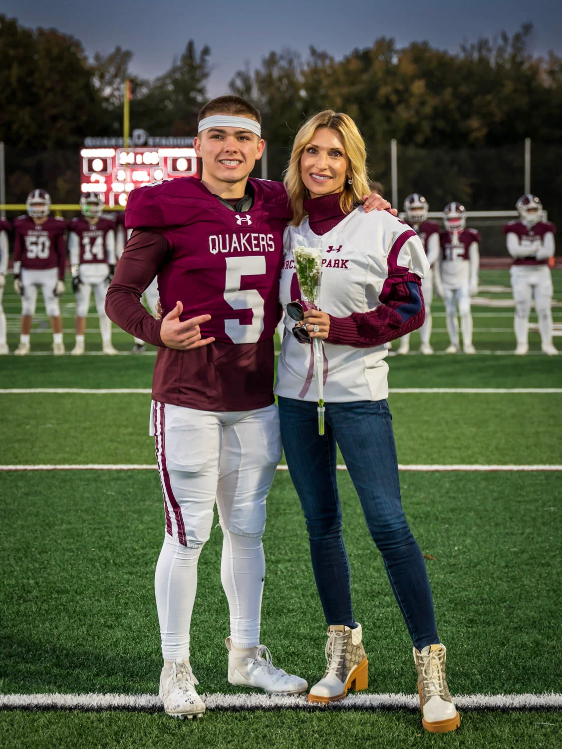 Teacher and player on Senior Night