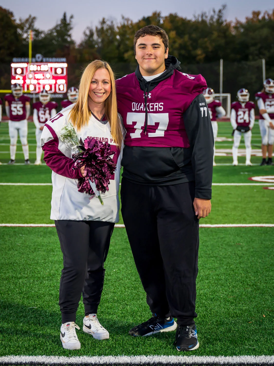 Teacher and player on Senior Night