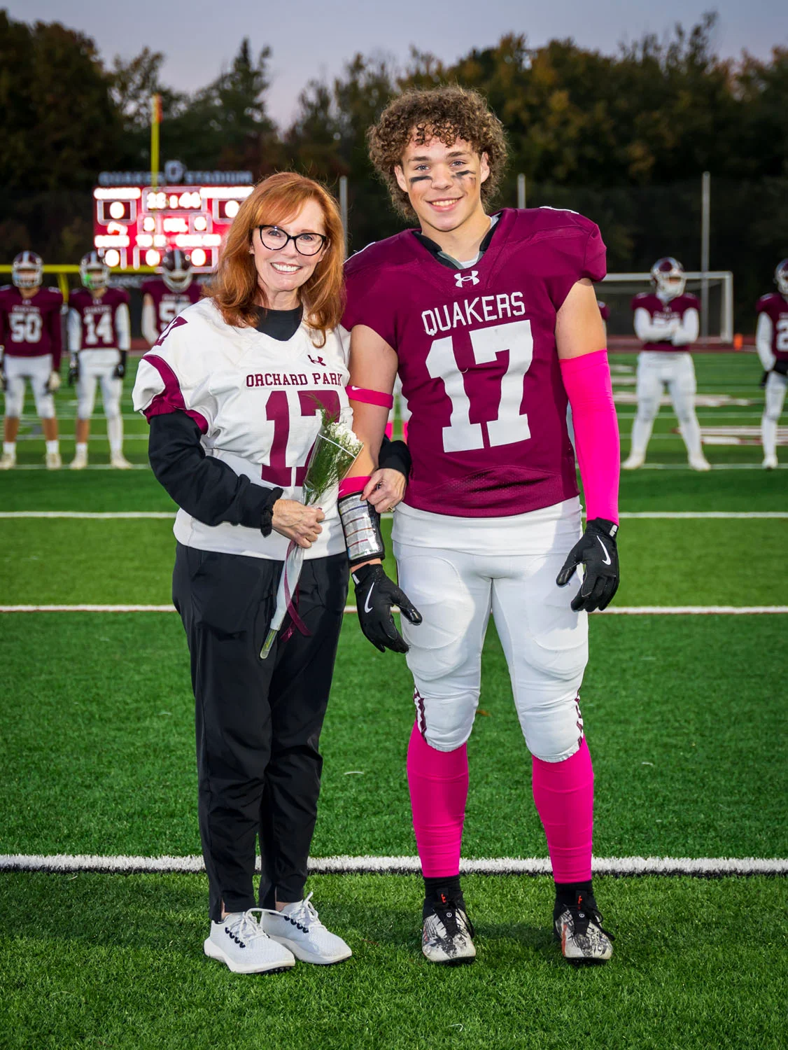 Teacher and player on Senior Night