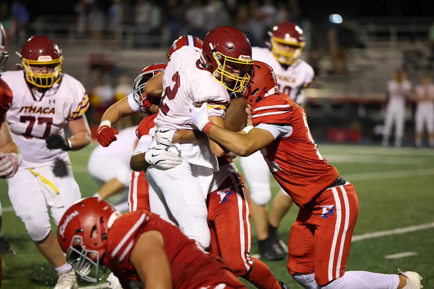 Defense making the tackle