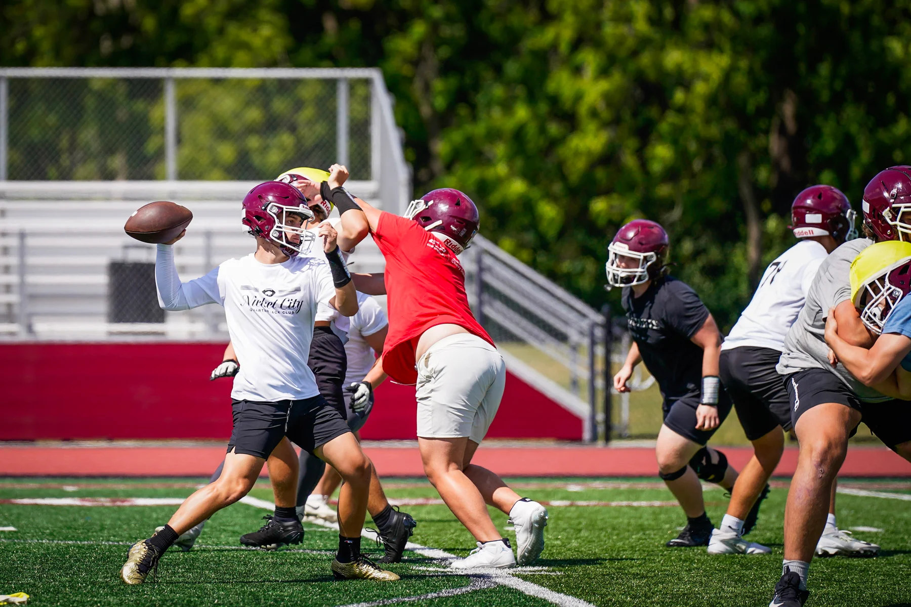 QB throwing the ball while in traffic