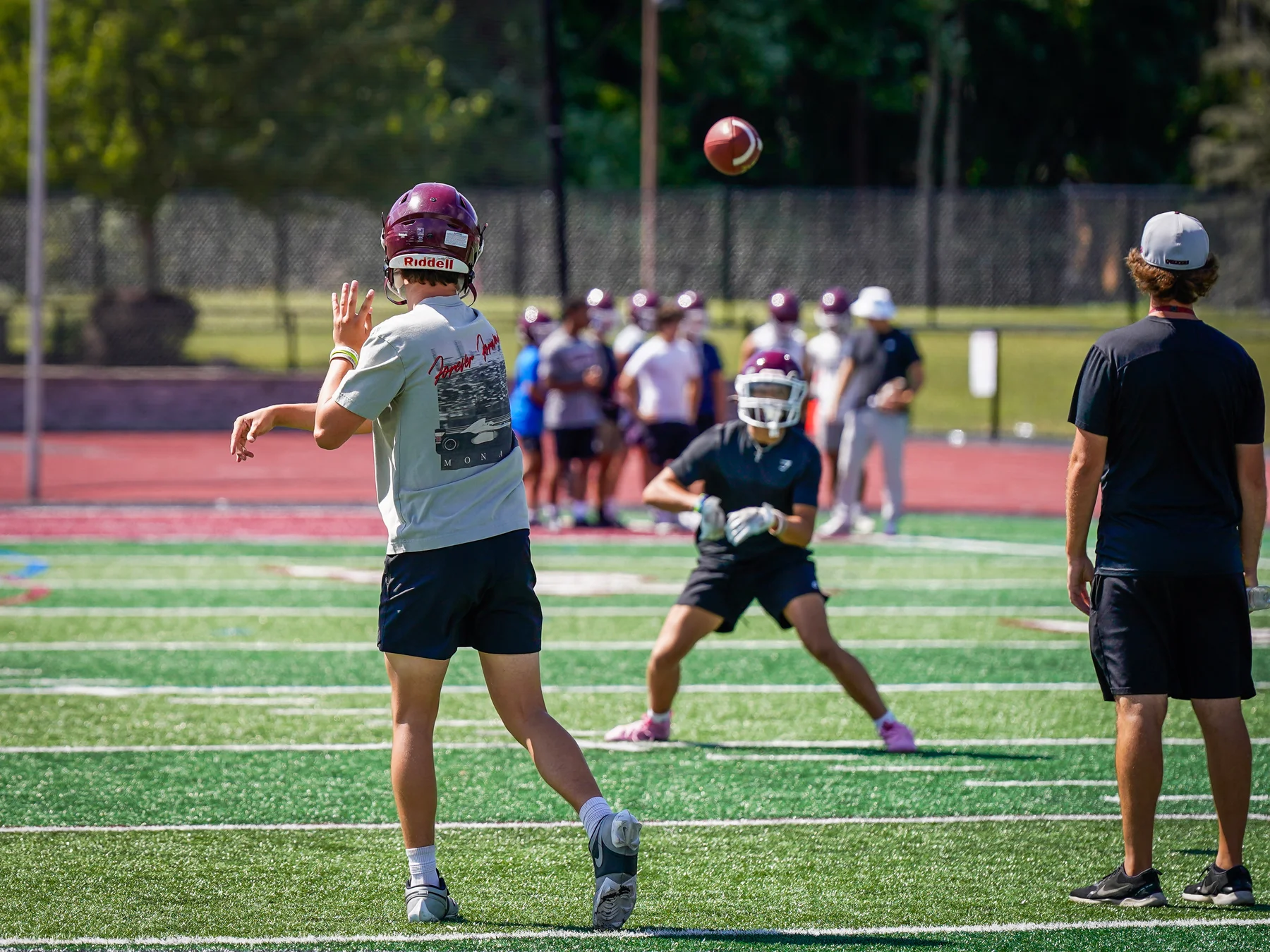 QB throwing the ball to the WR