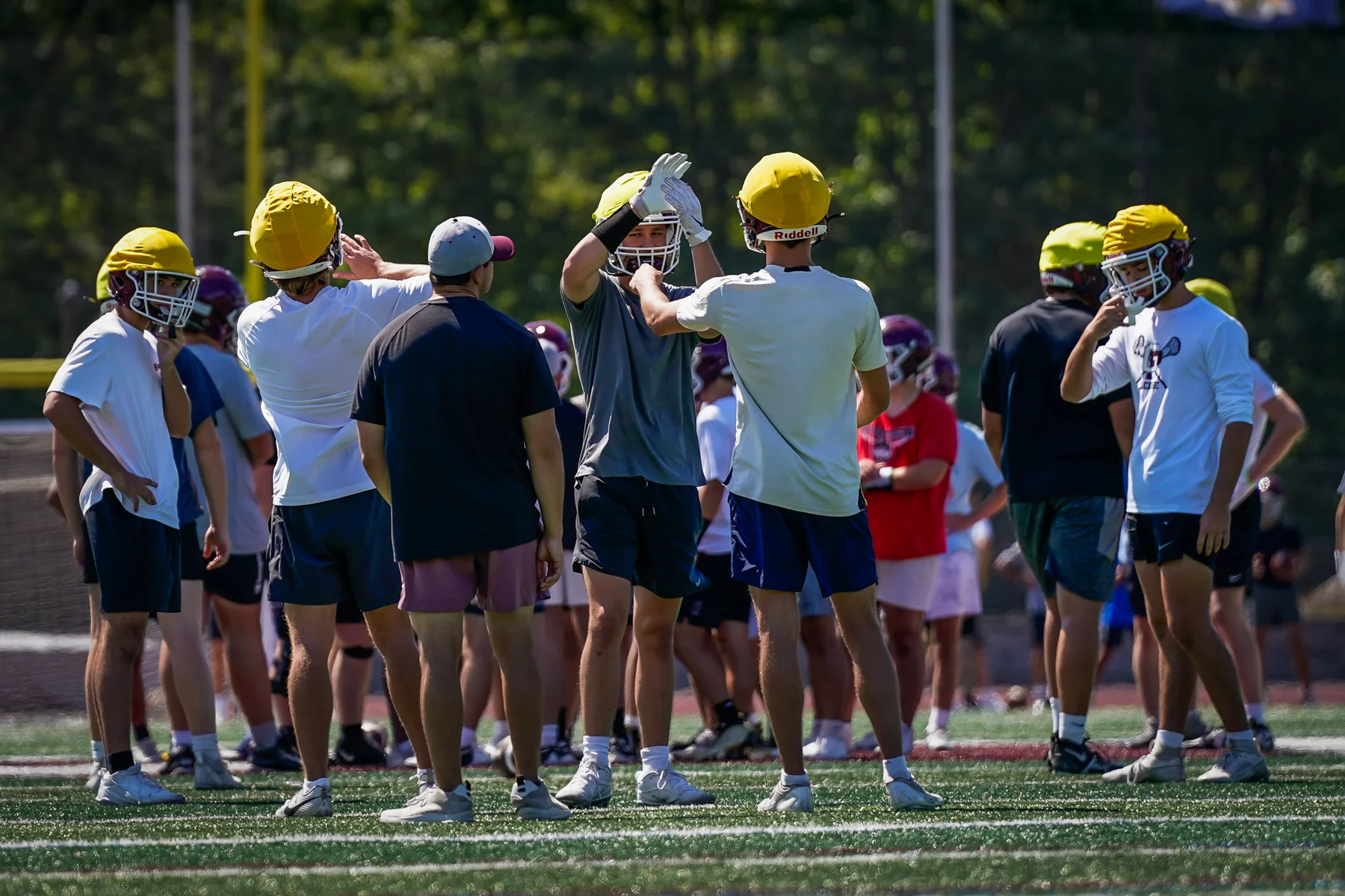 Coach talking to players during practice