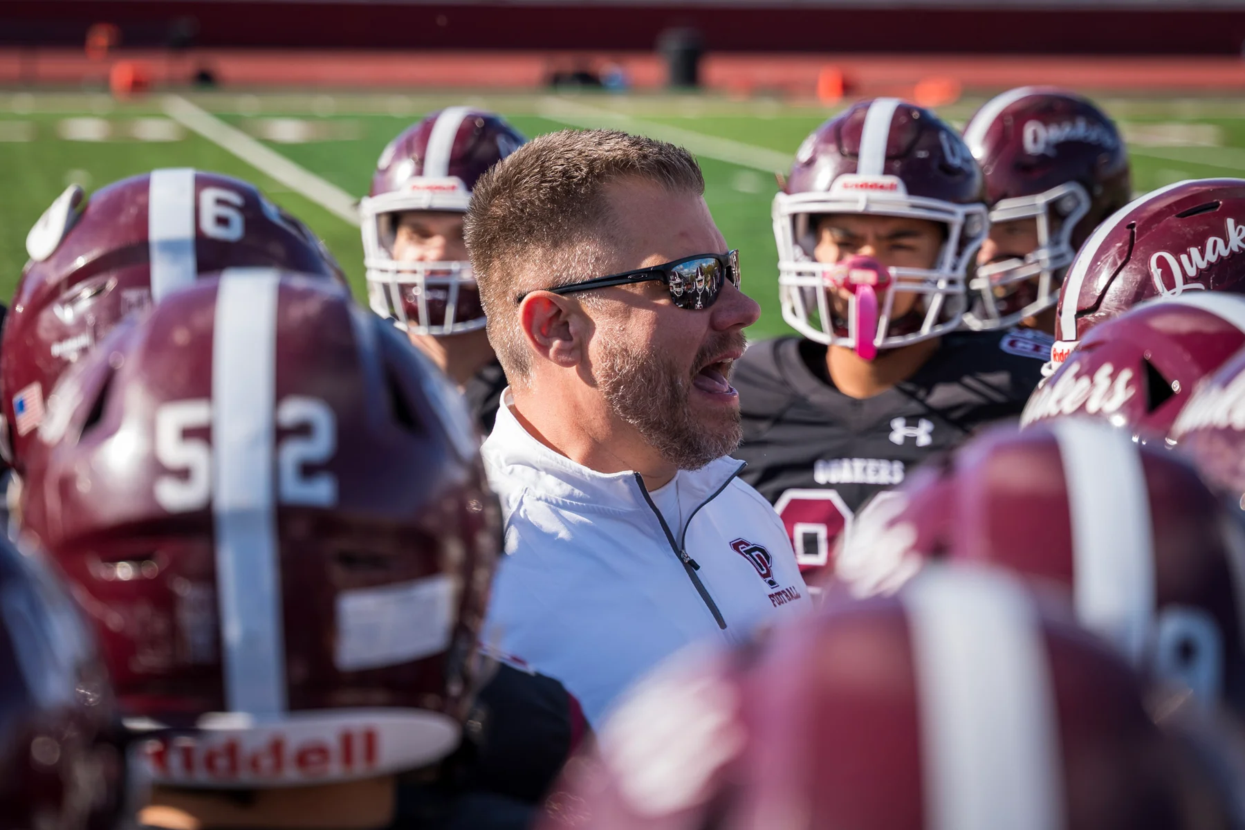 Orchard Park Football Coach talking to the team
